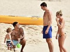 Fancy seeing you here: Man Utd star Jonny Evans bumps into Tottenham's Kyle Walker on a Barbados beach