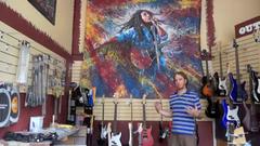 how did outpost music get tom noll's giant bob marley painting?